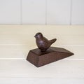 Cast iron door wedge with bird deco