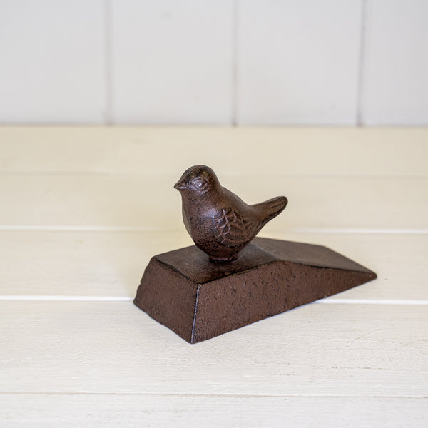 Cast iron door wedge with bird deco